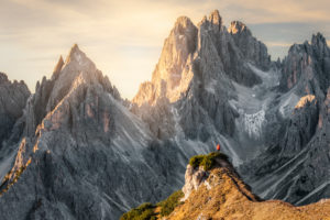 Hiker standing in front of the sharp peaks of Cadini di Misurina, Dolomites, Auronzo di Cadore, Belluno, Veneto, Italy Hiker standing in front of the sharp peaks of Cadini di Misurina, Dolomites, Auronzo di Cadore, Belluno, Veneto, Italy